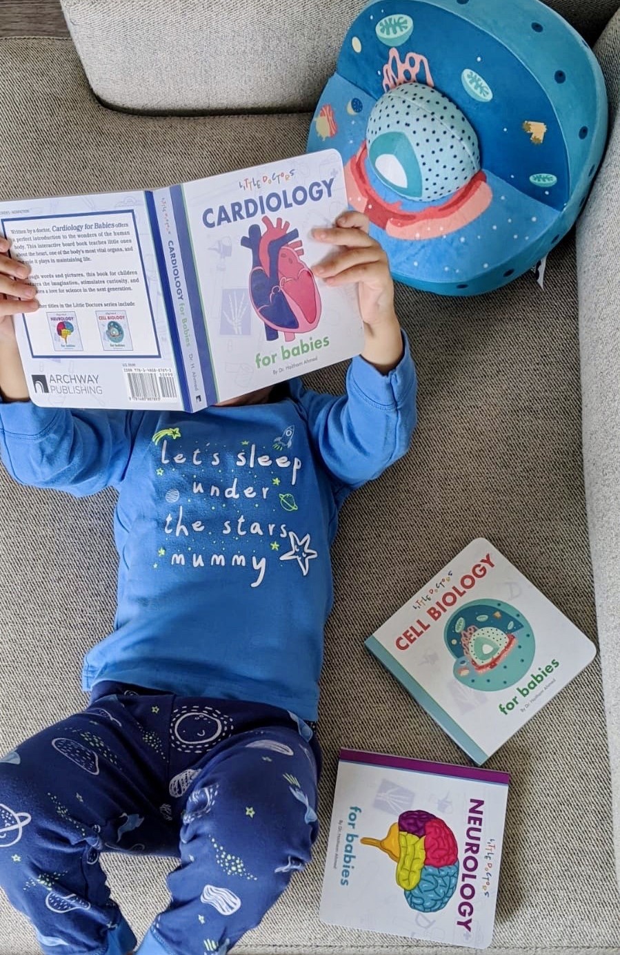 Baby being read to by parent